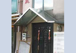 Canopy above a door opening on ground floor